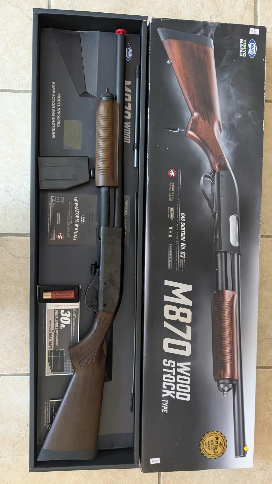 Tokyo Marui M870 Gas Shotgun Wood stock type.